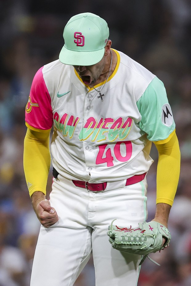 Jason Adam #40 of the San Diego Padres celebrates after Max Kepler #17 of the Philadelphia Phillies popped up to end the first half of the eighth inning at Petco Park on Friday, July 11, 2025 in San Diego, CA. (Meg McLaughlin / The San Diego Union-Tribune)