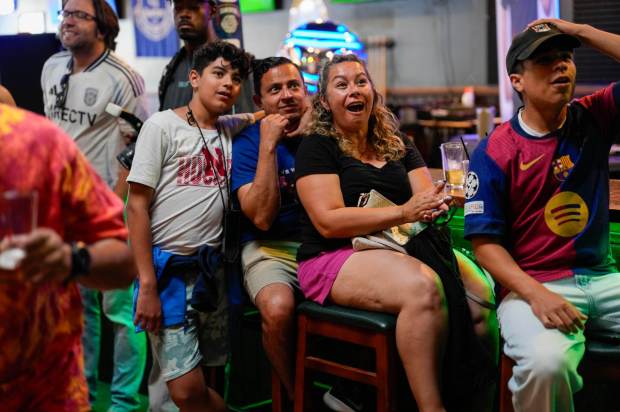 The Gonzales family watching the game. San Diego FC fans watch the MLS All-Star Game exhibition against the best players from Liga MX at the team's official watch party at The Harp Irish Pub and Restaurant in Ocean Beach on 07.23.25, in San Diego, California. (Alejandro Tamayo / The San Diego Union-Tribune)