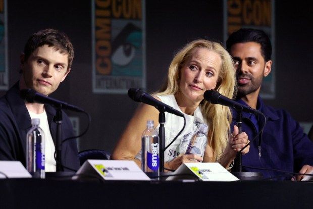 Evan Peters, Gillian Anderson and Hasan Minhaj speak onstage at Walt Disney Pictures' "TRON: Ares" Panel during 2025 Comic-Con International: San Diego at San Diego Convention Center on July 25, 2025 in San Diego, California. (Photo by Amy Sussman/Getty Images)