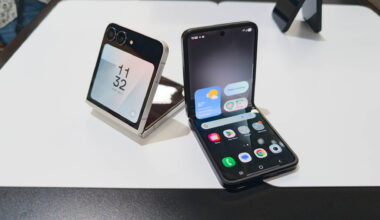Samsung Galaxy Z Flip 7 FE in both Black and White colorways unfolded partially on table