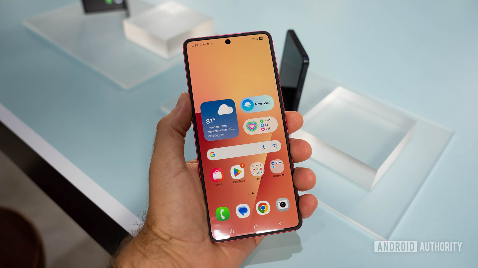 Samsung Galaxy Z Flip 7 in hand showing home screen