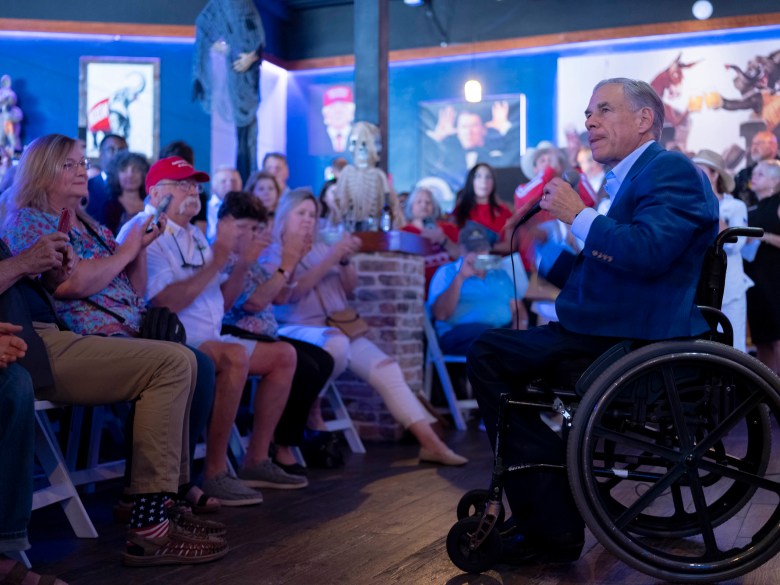 Governor Greg Abbott campaigns for Texas House candidate Marc LaHood (R-121) at the Angry Elephant on Wednesday.