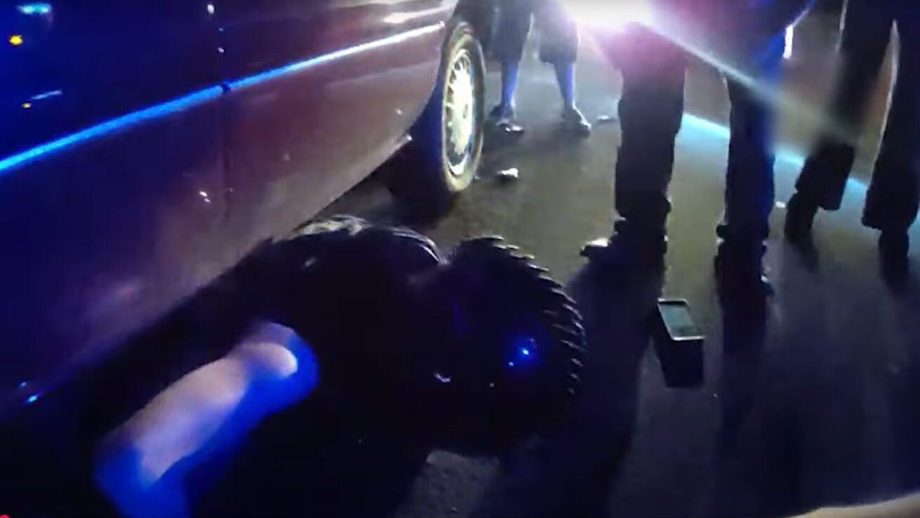 Motorcyclist trapped under car saved...