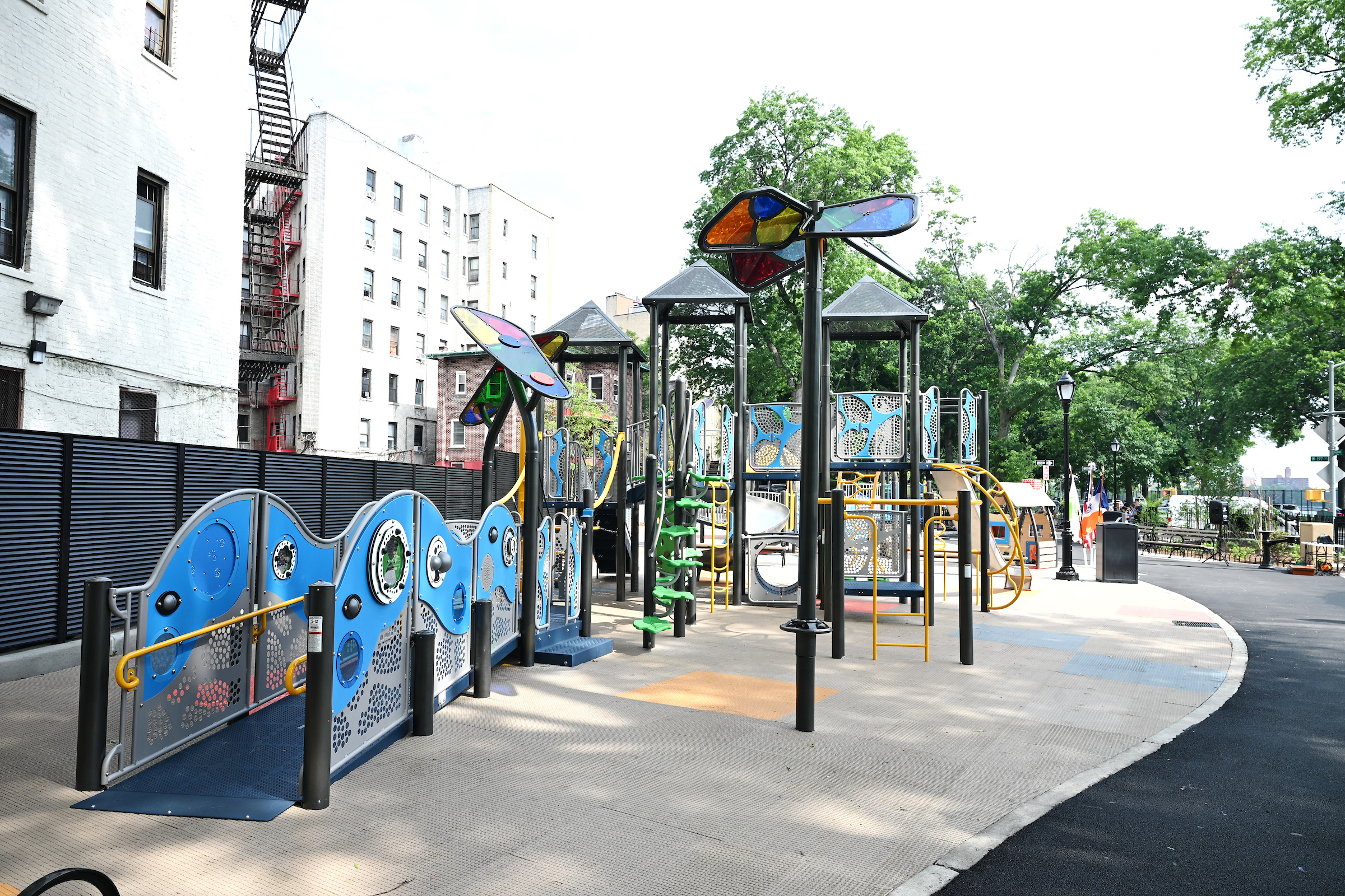 The newly renovated Strong Street Playground in Kingsbridge Heights features modern play equipment, spray showers