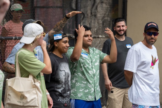 Contestants vie for $50 and a bag of pickles during an Adam Sandler lookalike contest in Vesuvio Playground in Manhattan on Friday, June 19, 2025. (Barry Williams/New York Daily News)