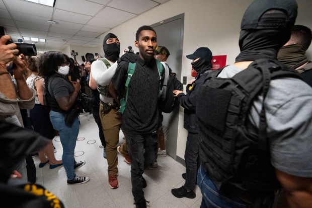 Federal law enforcement officers take immigrants into custody in Jacob K. Javits Building Thursday, July 3, 2025 in Manhattan, New York. (Barry Williams/ New York Daily News)