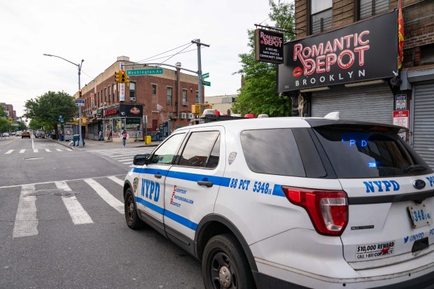 A hit-and-run driver in a burgundy-colored Ford Explorer killed a 55-year-old man crossing Washington Ave. at Fulton St. in Clinton Hill, Brooklyn early Saturday, May 17, 2025. (Theodore Parisienne / New York Daily News)