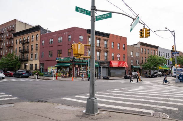 A hit-and-run driver in a burgundy-colored Ford Explorer killed a 55-year-old man crossing Washington Ave. at Fulton St. in Clinton Hill, Brooklyn early Saturday, May 17, 2025. (Theodore Parisienne / New York Daily News)