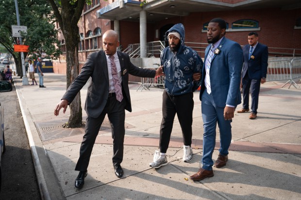 Travis Profit is walked from the 41th Pct. Thursday, July 10, 2025 in Queens, New York. (Barry Williams/ New York Daily News)
