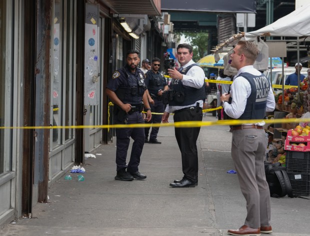 NYPD officers and detectives investigate a fatal shooting near the intersection of Southern Blvd. and Westchester Ave. Tuesday, July 8, 2025 in the Bronx, New York. (Barry Williams/ New York Daily News)