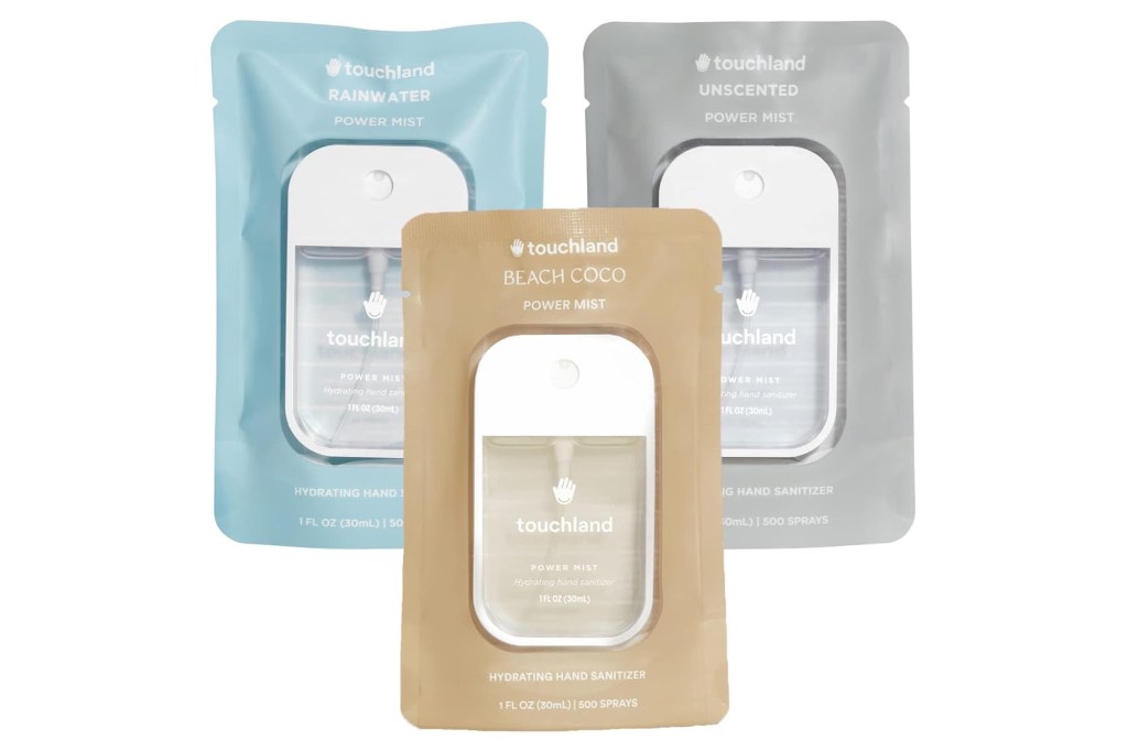 Three Touchland Power Mist hand sanitizer packets in Rainwater, Unscented, and Beach Coco scents.