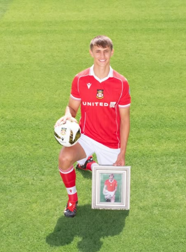Wrexham star Max Cleworth models the new 2025/26 Wrexham shirt