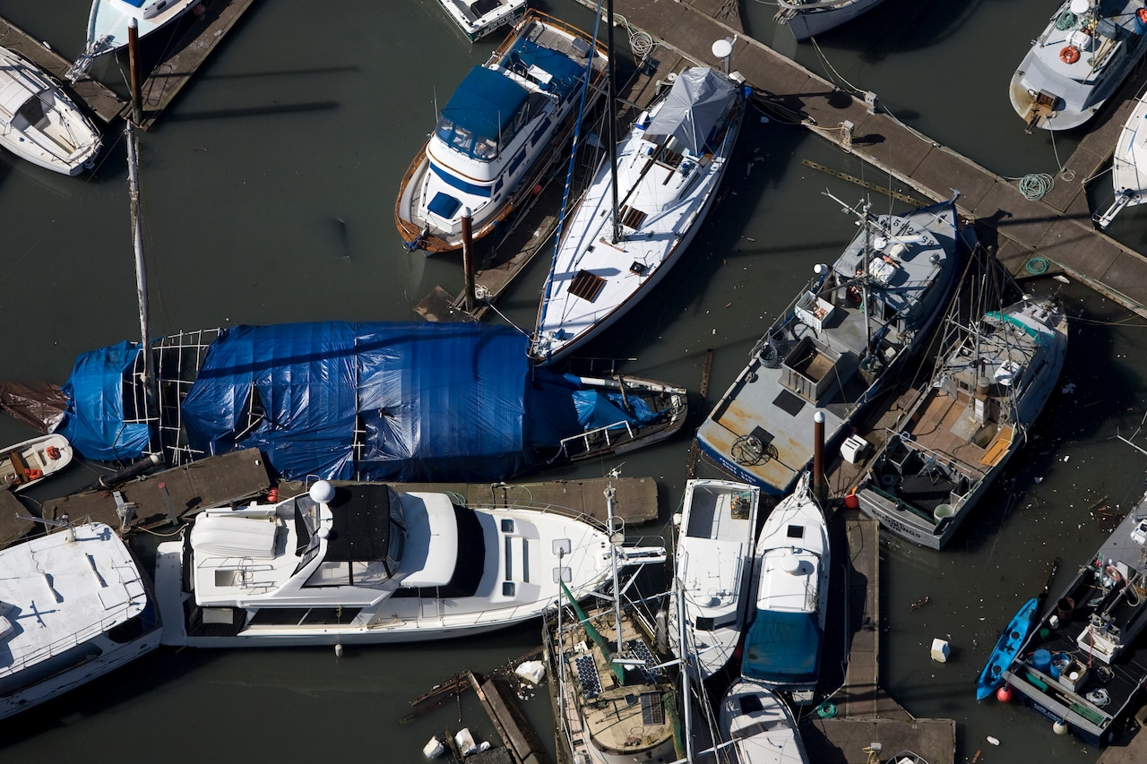Boats unmoored and collided in a marina
