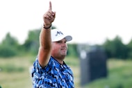 Golfer Patrick Reed reacts after sinking the winning putt in the LIV Golf Dallas tournament...