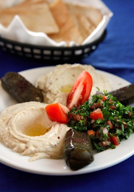 In this 2010 file photo at Sevan G&G, the mazza plate includes hummus, roasted eggplant dip,...