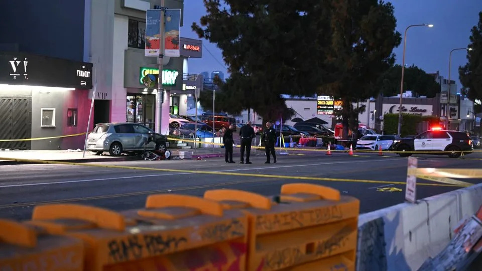 Officers stand at the scene near The Vermont Hollywood music venue after a vehicle drove into a crowd early Saturday. - Robyn Beck/AFP/Getty Images