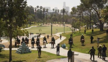 Federal officers with military vehicles deploy to Los Angeles park