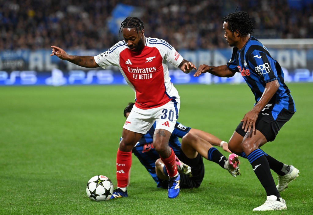 BERGAMO, ITALY - SEPTEMBER 19: Raheem Sterling of Arsenal takes on Juan Cuadrado of Atalanta during the UEFA Champions League 2024/25 League Phase MD1 match between Atalanta BC and Arsenal FC at Stadio di Bergamo on September 19, 2024 in Bergamo, Italy. (Photo by Justin Setterfield/Getty Images)