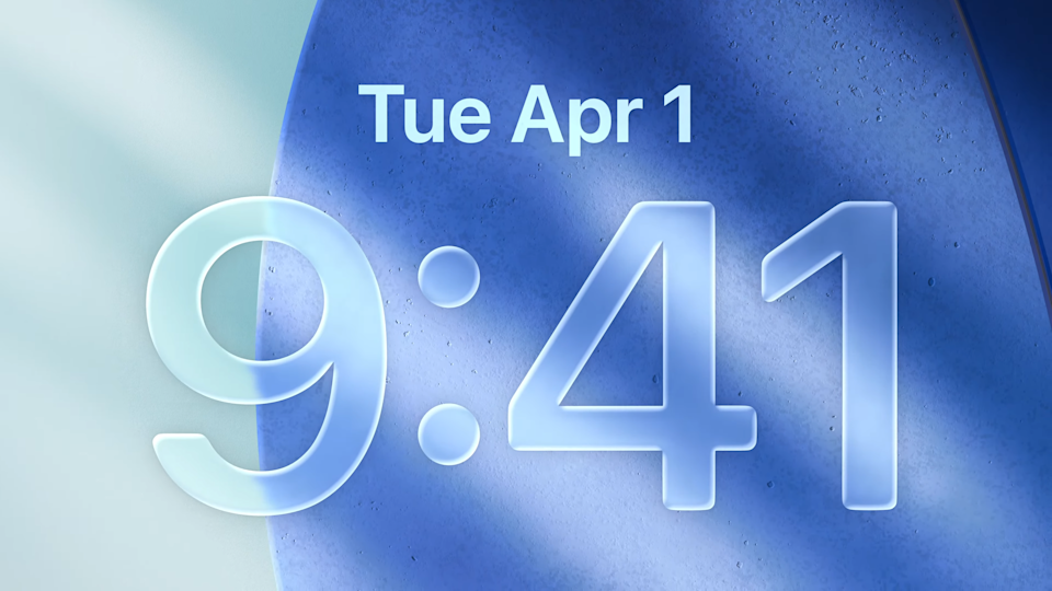 An iPhone lockscreen with Apple's Liquid Glass redesign in iOS 26.