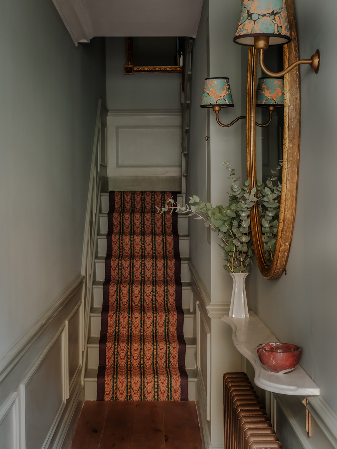 blue entryway with red runner
