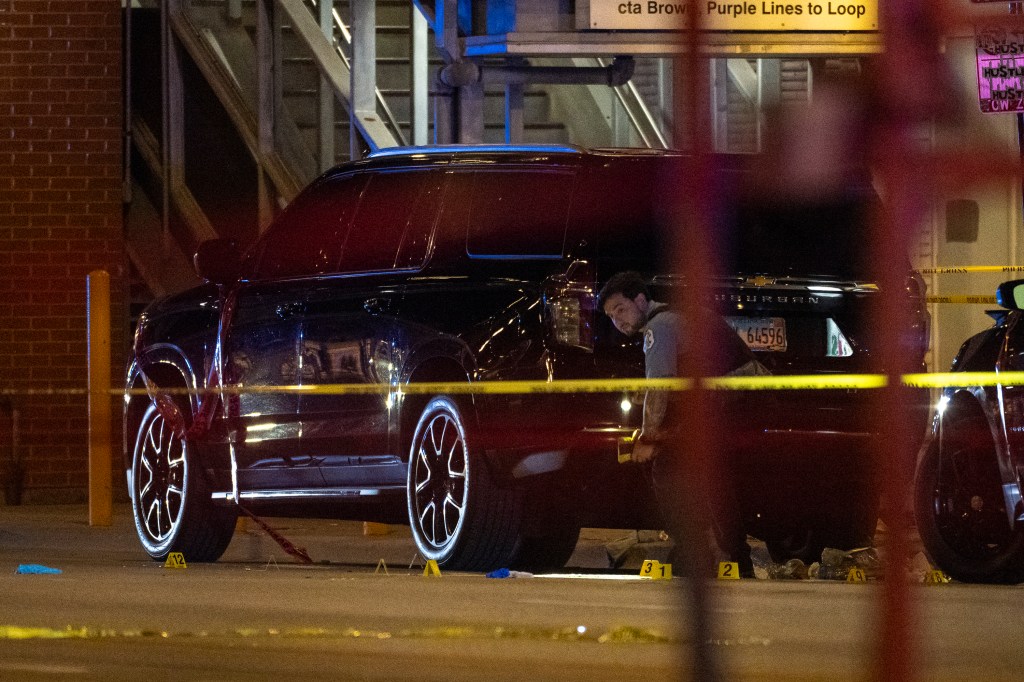 A car is parked inside police tape in Chicago, Illinois after the shooting.