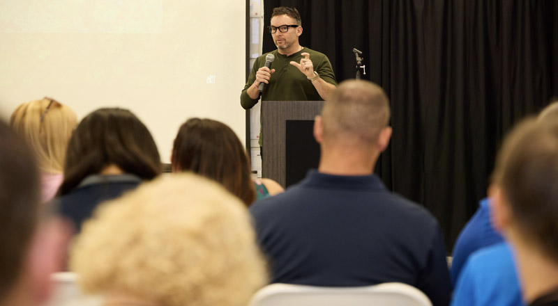 Andrew Koenig delivering opening remarks at CITY Furniture's Green Summit in Tamarac, FL