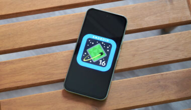 The Android 16 logo on a Google Pixel 8a outdoors.