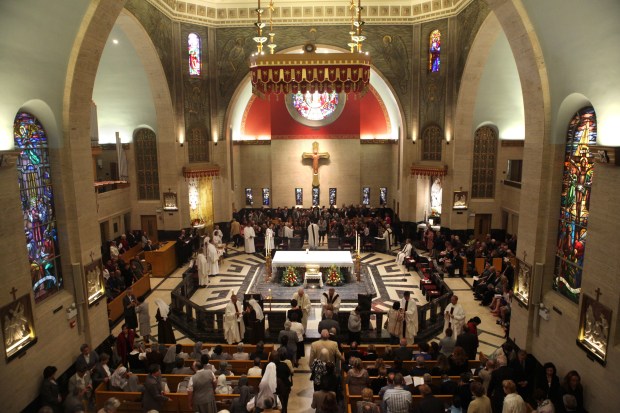 Church members receive communion during the inaugural liturgy and rite of blessing at the National Shrine of Saint Frances Xavier Cabrini Sept. 30, 2012. (Armando L. Sanchez/Chicago Tribune) 
