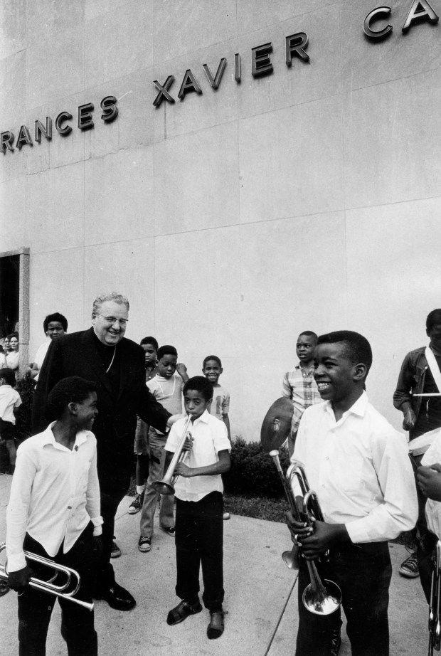 Cardinal John Cody greets members of the Old Town Boys Club who played at the dedication ceremony for the Cabrini Community Health Center on July 15, 1970, next to St. Cabrini Hospital. (David Nystrom/Chicago Tribune)