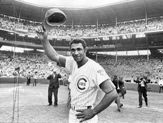 Chicago Cubs player Billy Williams doffs his cap to the Wrigley Field fans after receiving a trophy marking his 896th consecutive game, a National league record on June 29, 1969. (John Austad/Chicago Tribune)
