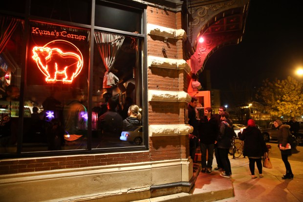 People wait in line at Kuma's Corner on Nov. 7, 2014. (Chris Sweda/Chicago Tribune)