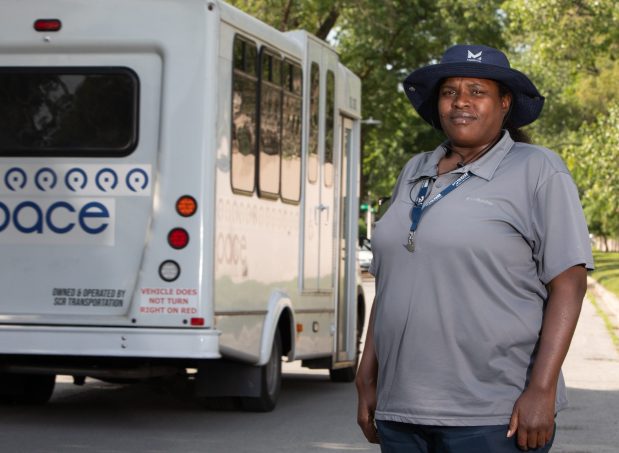 Enterna Williams, a paratransit driver for Pace and a Teamster 727 member, is passed by another Pace bus on June 26, 2025, in Chicago. (Hailey Hoffman/for the Chicago Tribune)