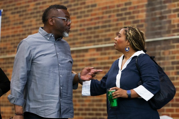Mayor Brandon Johnson speaks with Budget Director Annette Guzman during a budget roundtable at Truman College in Uptown, June 28, 2025. (Eileen T. Meslar/Chicago Tribune)