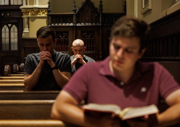 Matt Peterson, from left, Inigo Curran and Carlos Gonzalez attend an LGBTQ outreach mass at Our Lady of Mount Carmel Church on July 13, 2025, in Chicago. (Armando L. Sanchez/Chicago Tribune)