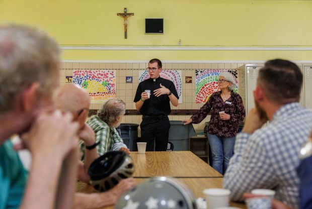 The Rev. Andy Matijevic, center, and Angelina Rossi, right, answer questions after an LGBTQ outreach mass at Our Lady of Mount Carmel Church on July 13, 2025, in Chicago. (Armando L. Sanchez/Chicago Tribune)