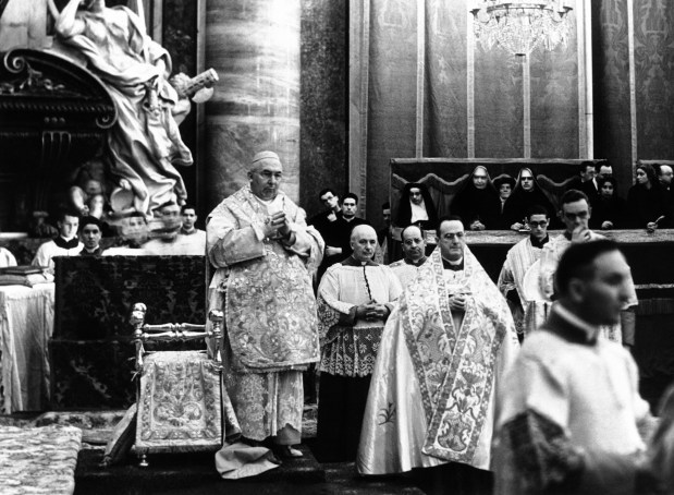 Cardinal George Mundelein celebrates the Pontifical Mass in St. Peter's, Rome, Italy on Nov. 13, 1938, in connection with the beatification of Mother Frances Cabrini. It was the first time an American cardinal had celebrated Mass in St. Peters. (AP Photo)