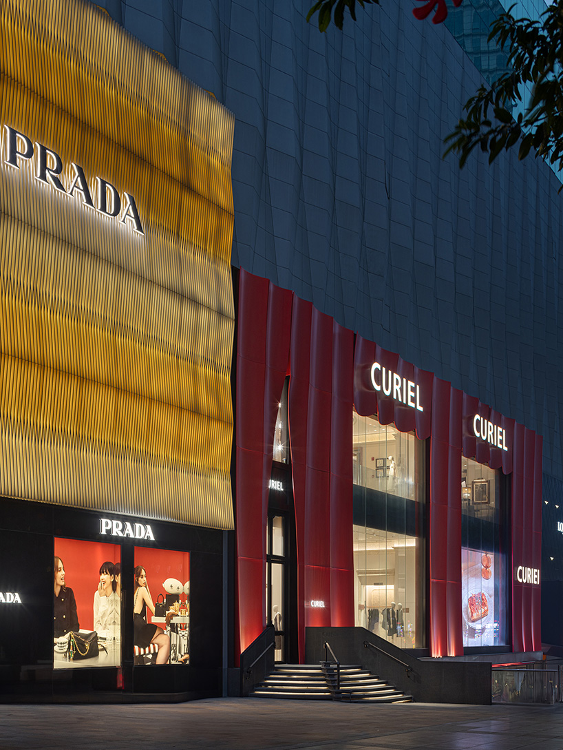 chongqing flagship's theatrical interiors by liang architecture evoke silk drapery in motion