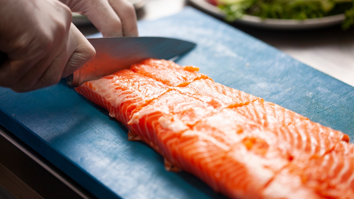 cutting salmon fillets