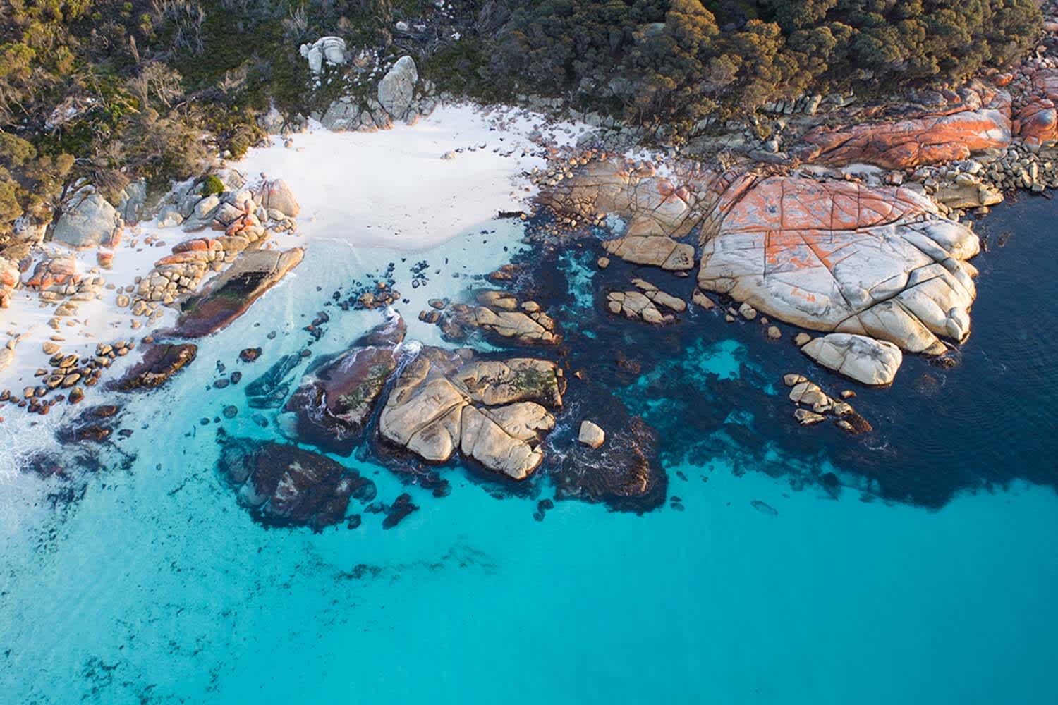 Aerial photograph captured at the Bay of Fires, Tasmania on sunrise.