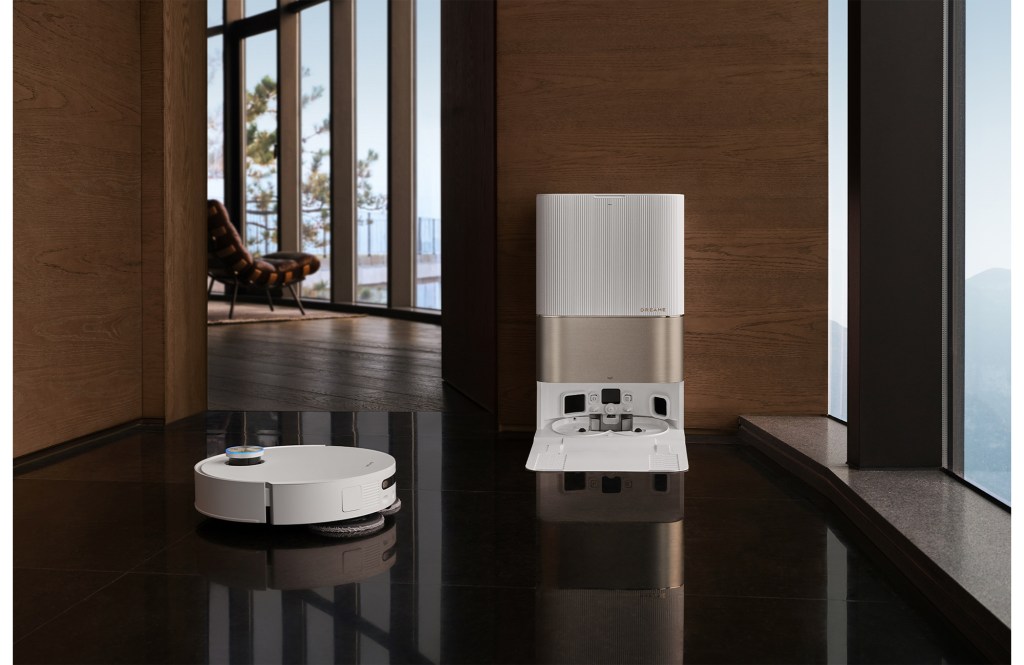 Robot vacuum and charging dock on a polished floor.