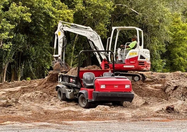 A heavy equipment operator moves earth as part of the renovation of the 14th tee of the Hyde Park Golf Club, on Jacksonville's Westside.