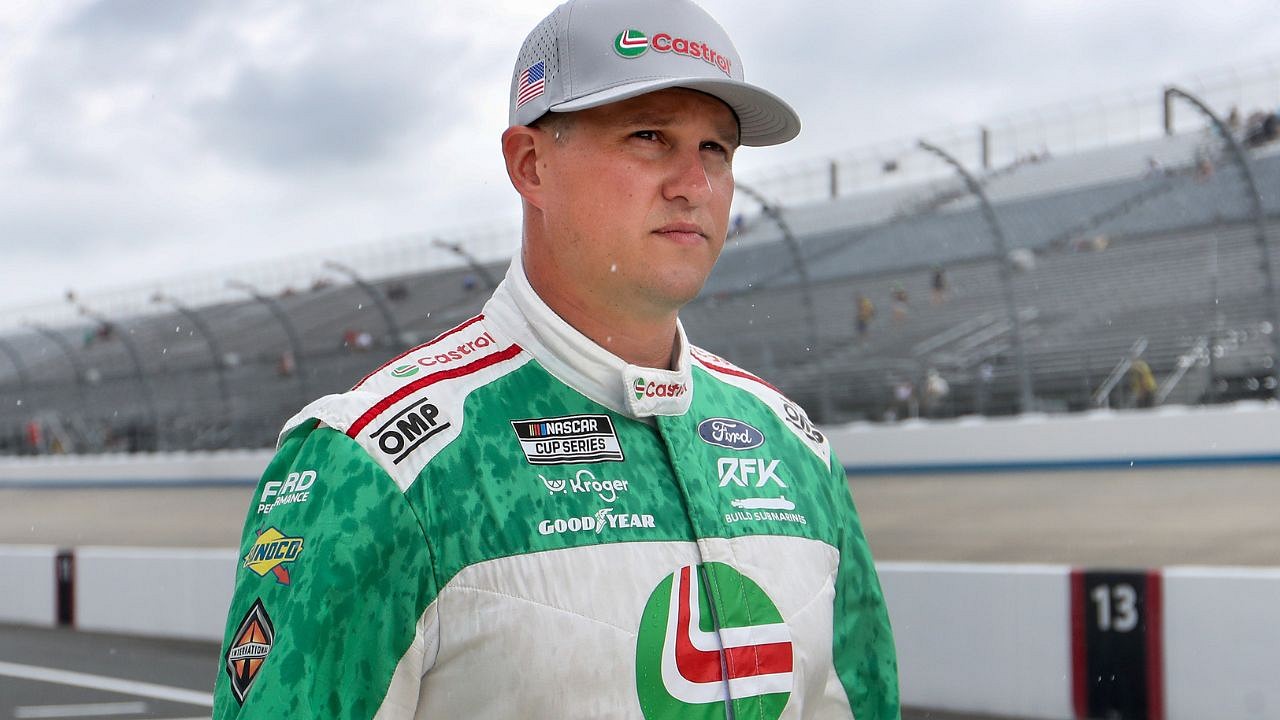 NASCAR Cup Series driver Ryan Preece (60) talks by his pit box Saturday, July 26, 2025, during qualifying for the Pennzoil 250 at Indianapolis Motor Speedway.