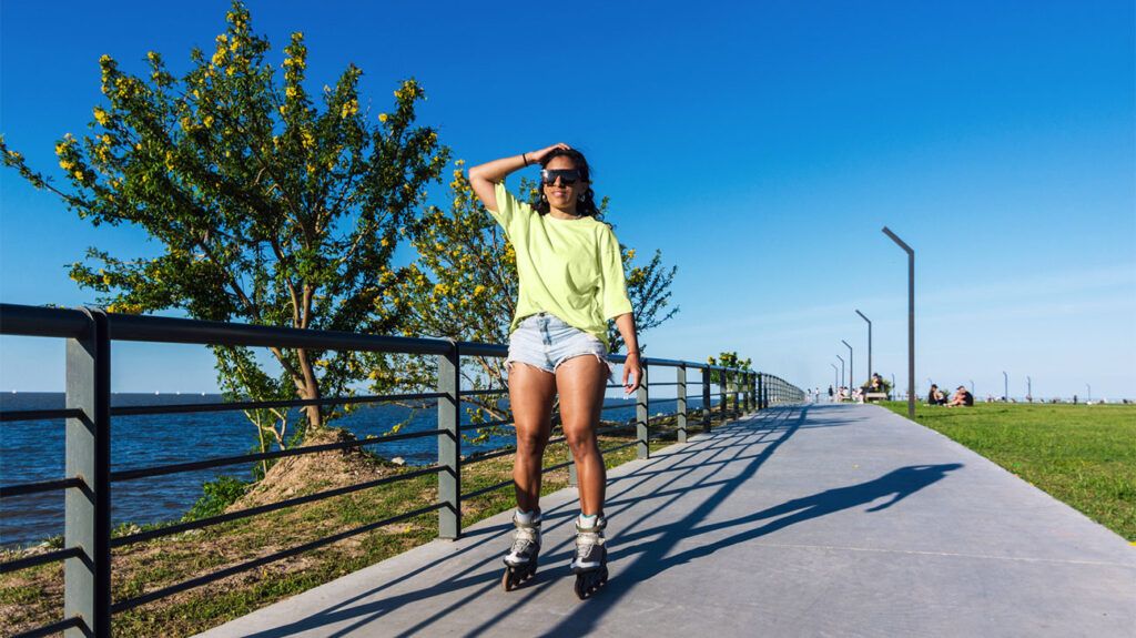 woman on roller skates along seafront