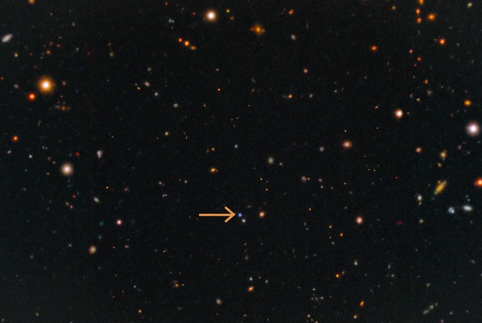 Marked with an orange arrow, the blue dot is the the fast X-ray transient EP 250108a, and the supernova that followed it. Using a combination of telescopes, astronomers found fast X-ray transients can result from the ‘failed’ explosive death of a massive star.