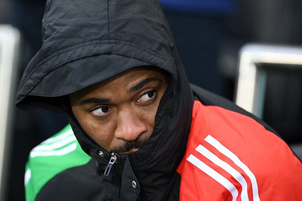 LONDON, ENGLAND: Raheem Sterling of Arsenal looks on, while sitting on the substitutes bench during the Premier League match between Fulham FC and ...