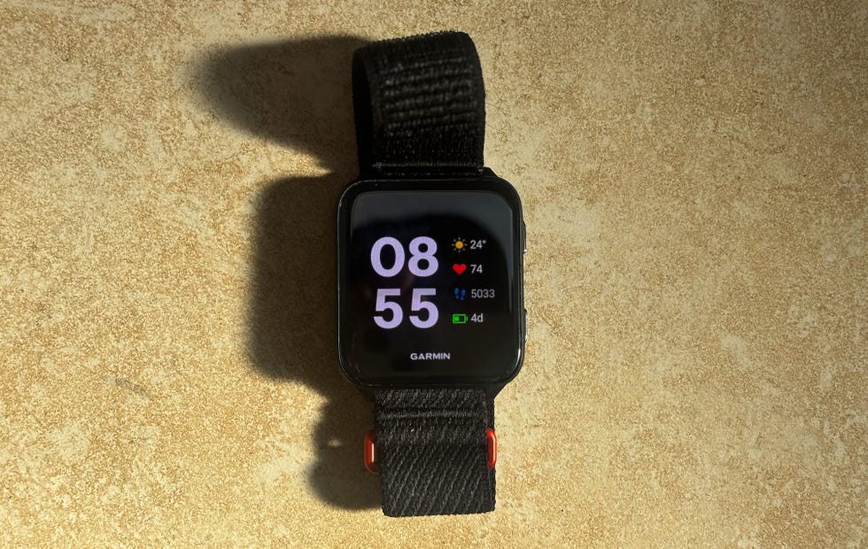 a black smartwatch with a colourful display screen