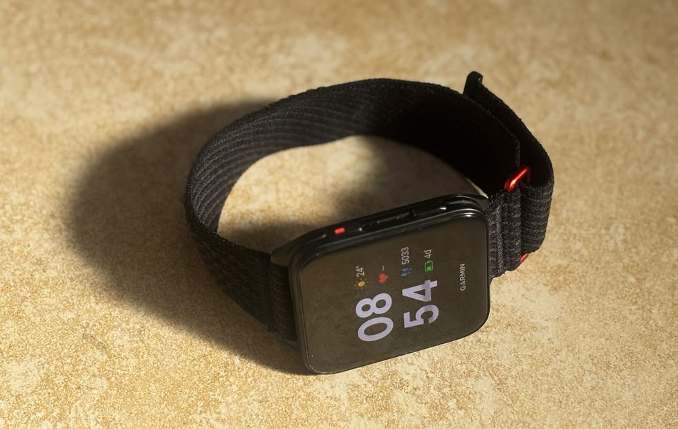 smartwatch displaying time and fitness metrics
