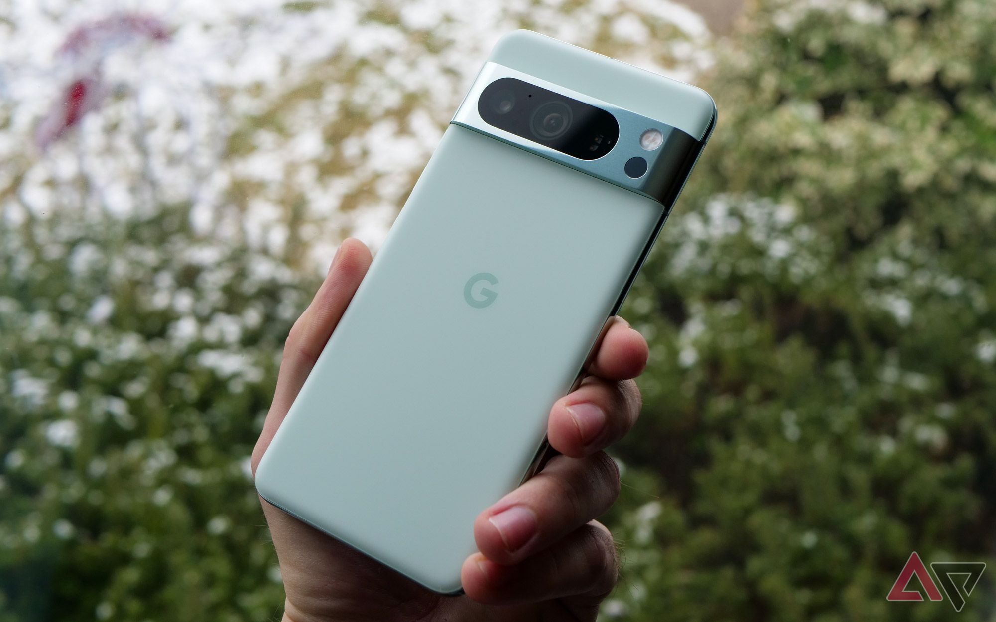 Google's Pixel 8 Pro in mint in a hand.