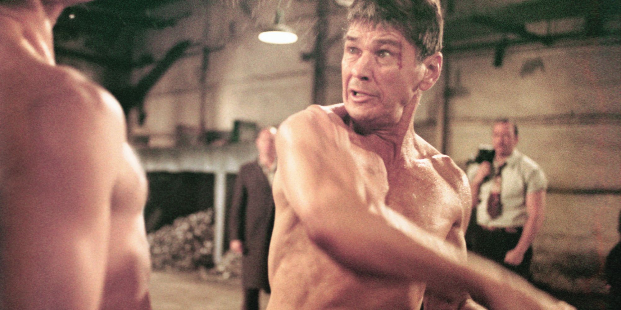 Charles Branson as Chaney fighting someone while barechested in the film Hard Times - 1975