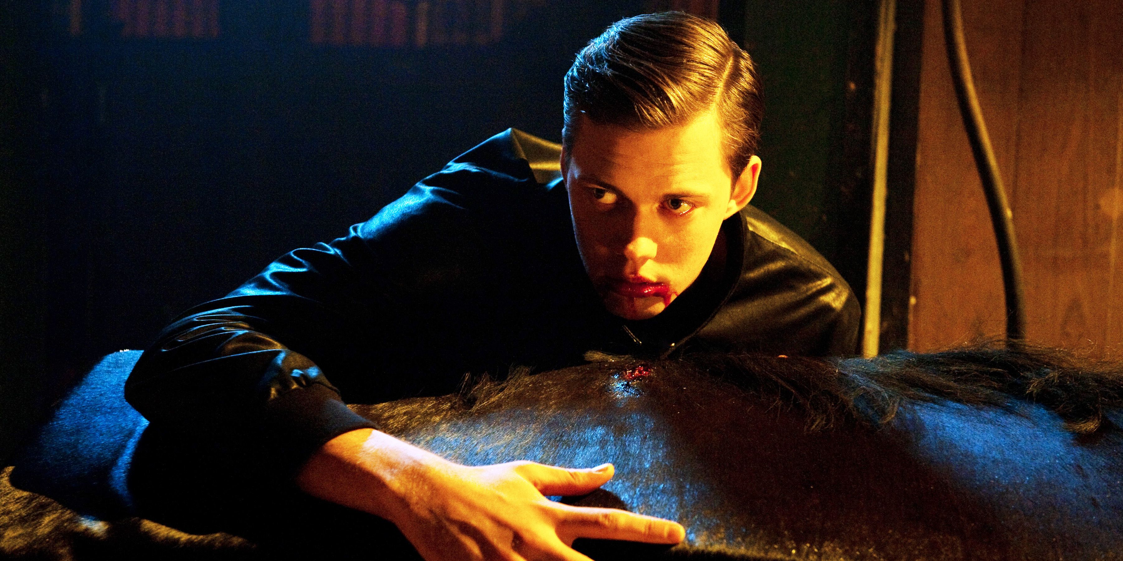 Hemlock Grove Bill Skarsgård as Roman Godfrey feeding from a horse